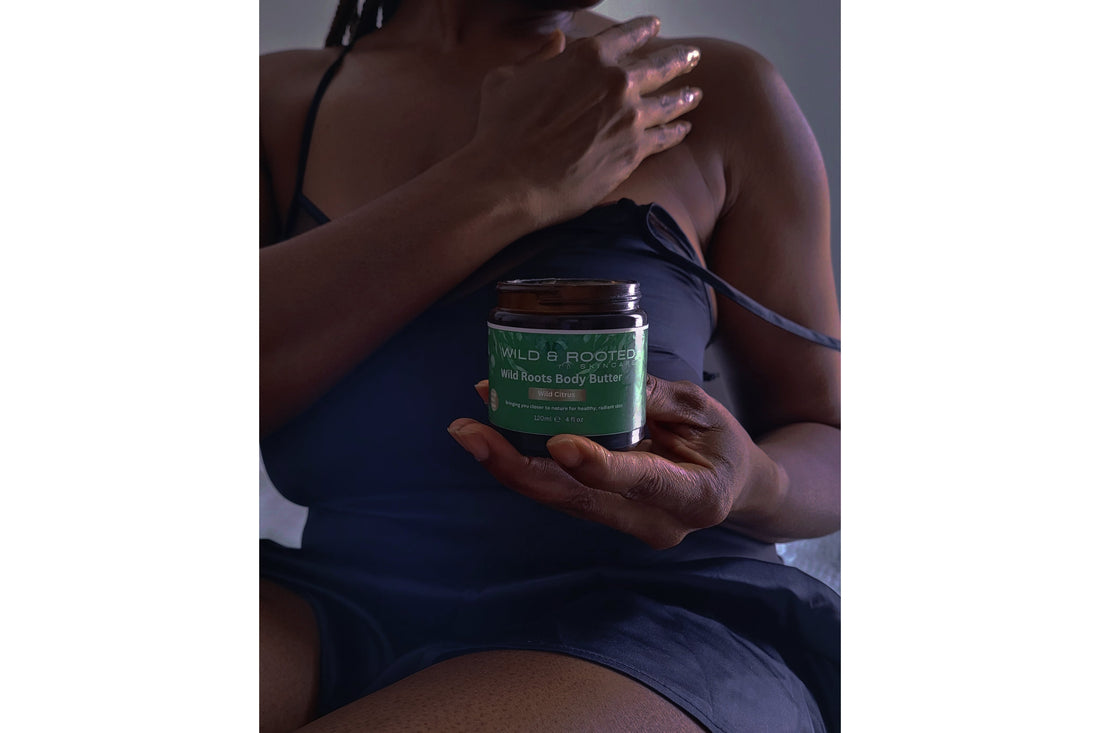 Woman applying body butter to her shoulders